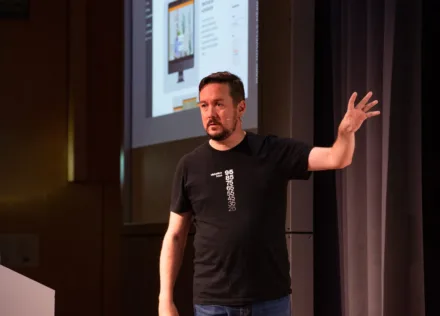 Mark Howells-Mead on stage at WordCamp Zurich