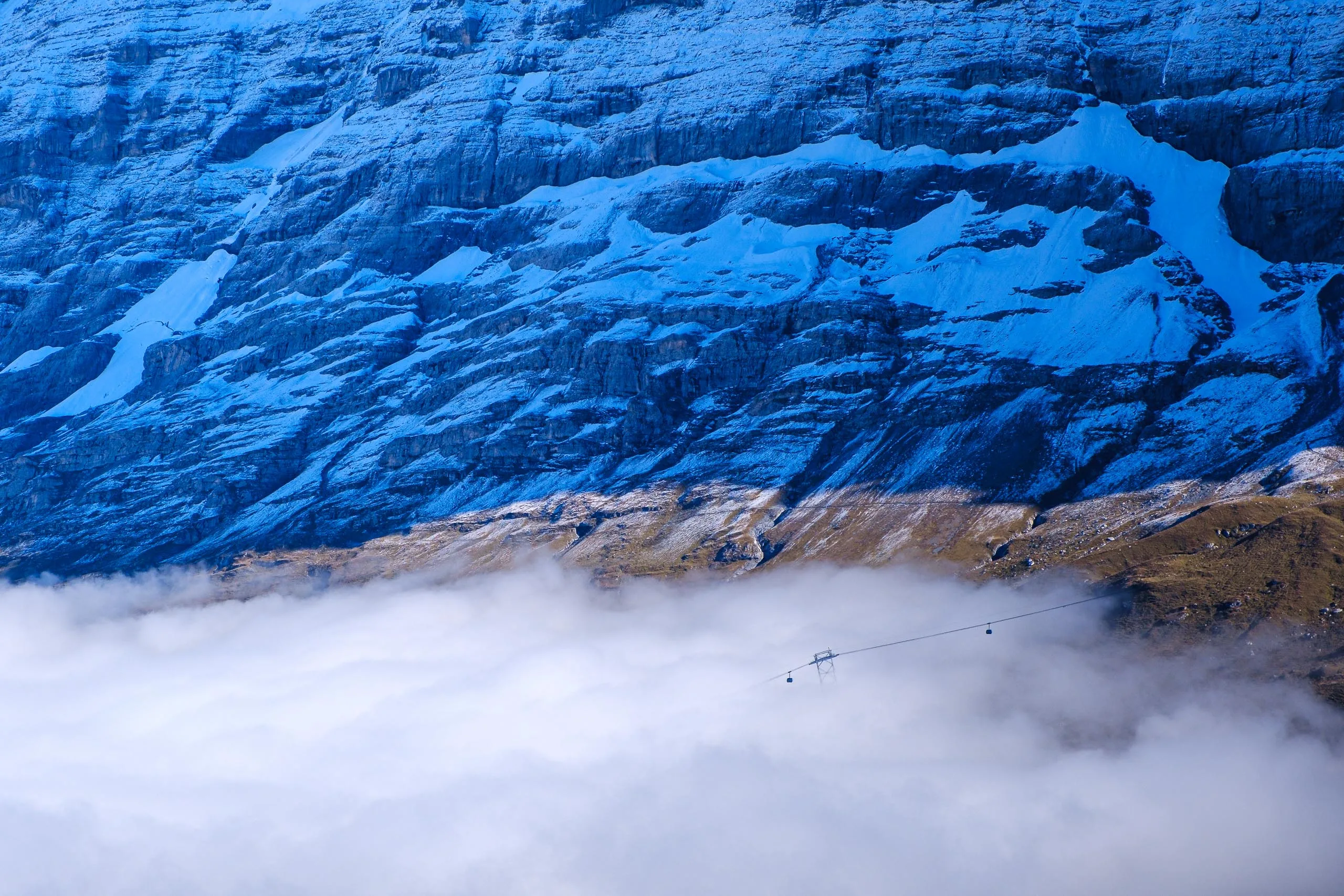 Cable cars emerging from a cloud inversion at Grindelwald
