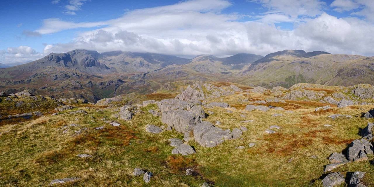 Summit view of Hard Knott, with the Scafell range in the distance