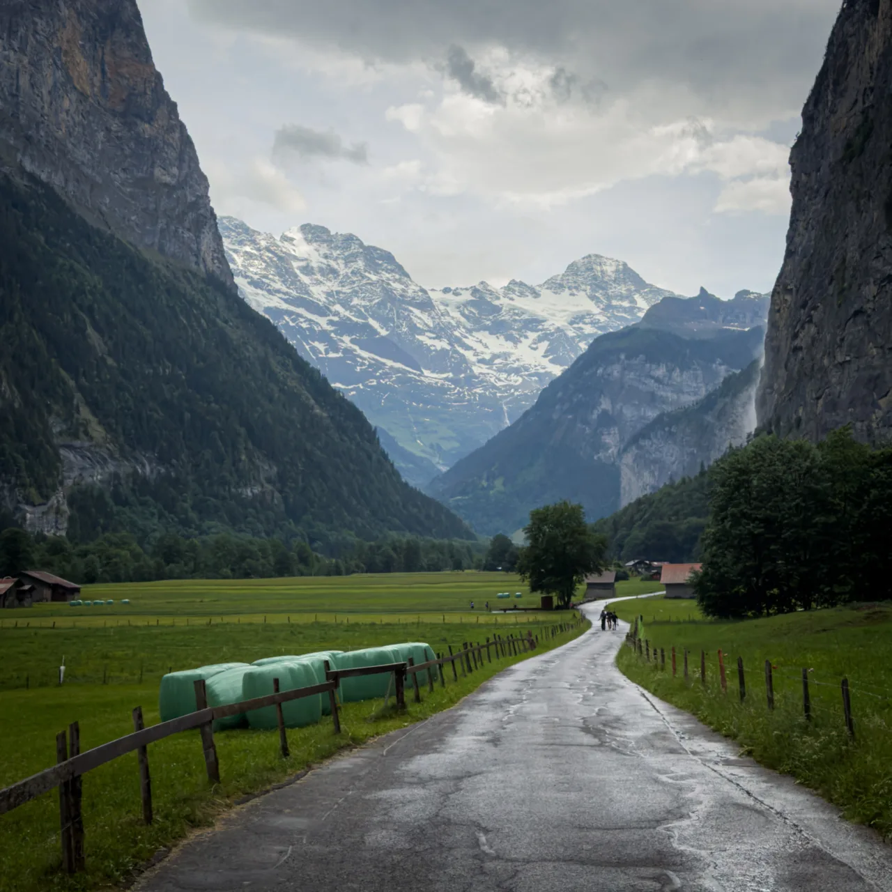 Rainy, narrow road leading along the Lauterbrunnen Valley